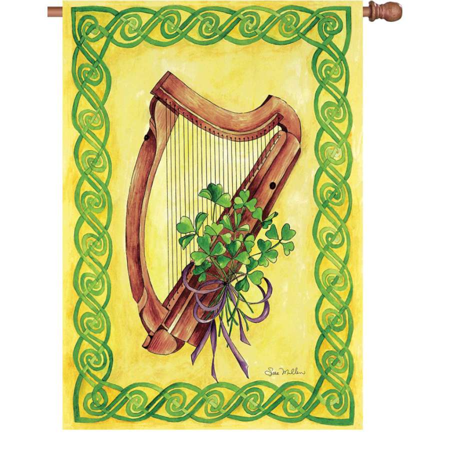 Illuminated 28 in. Celtic Harmony flag made of durable fade-resistant polyester featuring vibrant colors displayed in a garden setting.