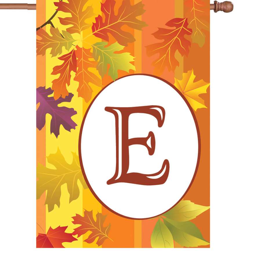28 in. Fall Monogram Flag - E with vibrant autumn colors and stylish initial 'E', displayed on a decorative pole in a front yard setting.