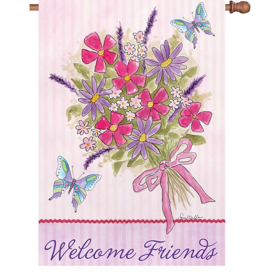 28 in. Flag - Bouquet for Friends displaying a colorful floral design with a 'Welcome Friends' message, fluttering gently in an outdoor garden.