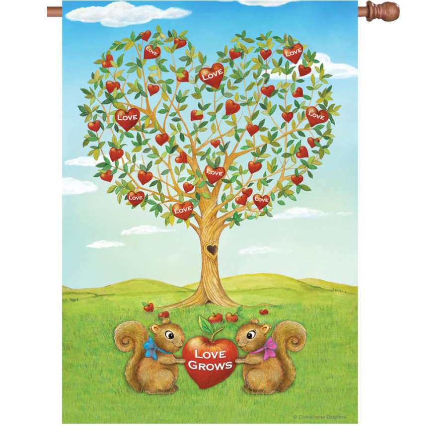 28 in. Flag - Love Grows displayed in a cheerful garden setting, showcasing a vibrant double-sided design that enhances outdoor decor.