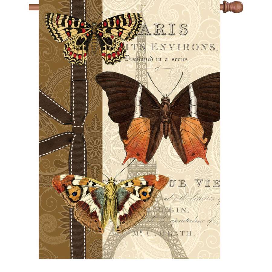 28 in. Parisian Pappillon garden flag displays a vibrant butterfly design, crafted from PremierSoft fabric, fluttering in an outdoor garden setting.