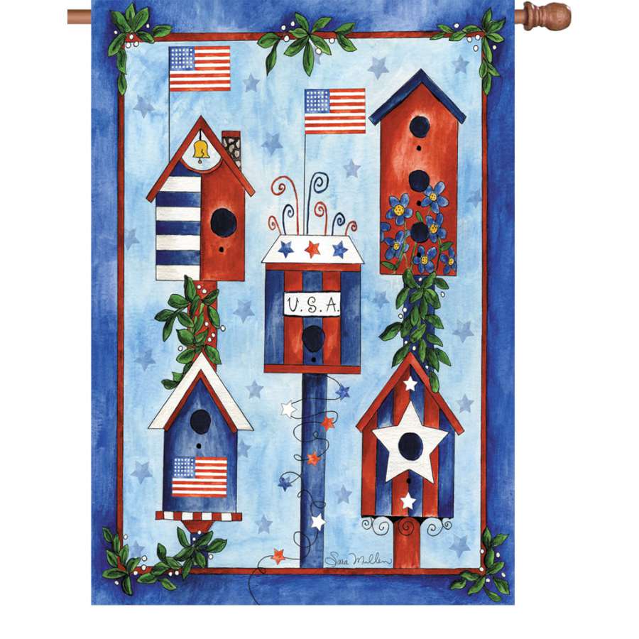 Illuminated 28 in. Flag Red White Blue Birdhouse featuring vibrant red, white, and blue colors, displayed in a garden setting.