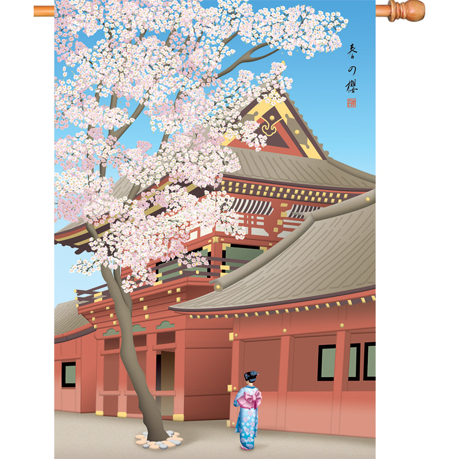 28 in. illuminated flag featuring cherry blossoms in bloom displayed on a pole in a serene garden setting.