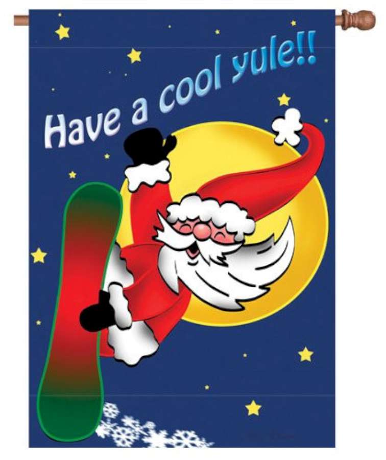 28 in. Flag featuring Snowboarding Santa design, displaying cheerful imagery, vibrant colors, and festive charm in a winter outdoor setting.