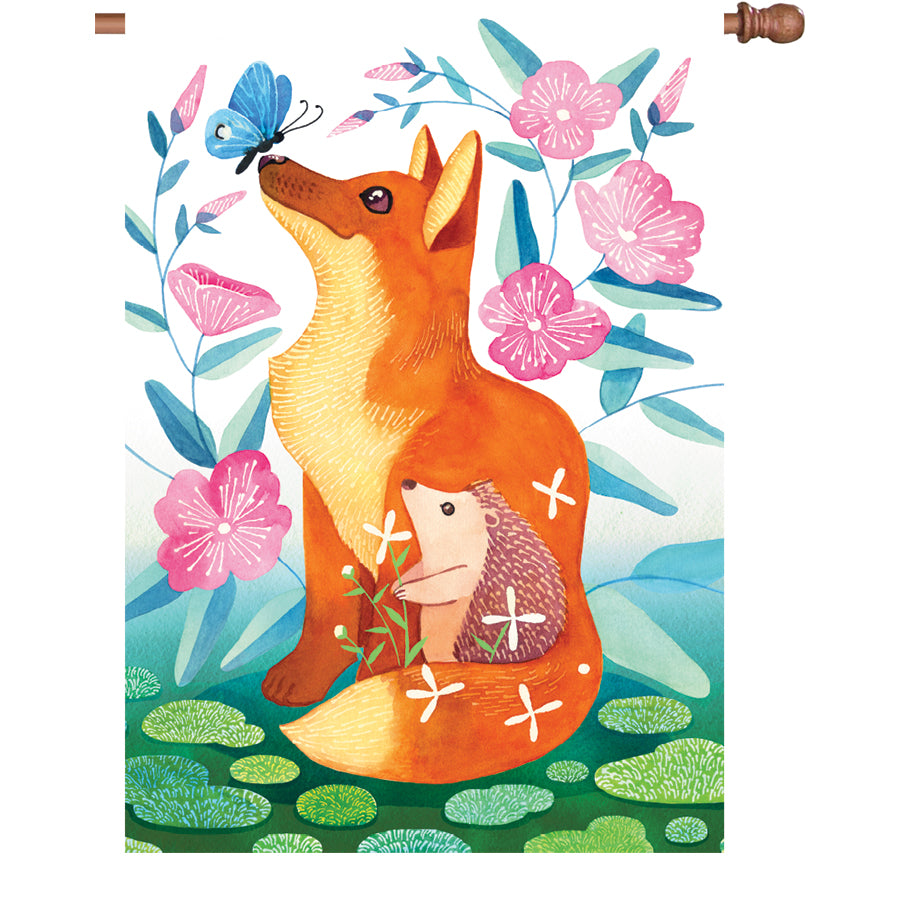 28 in. Fox & Hedgehog flag featured outdoors, showcasing vibrant colors and whimsical design in a sunny garden setting.