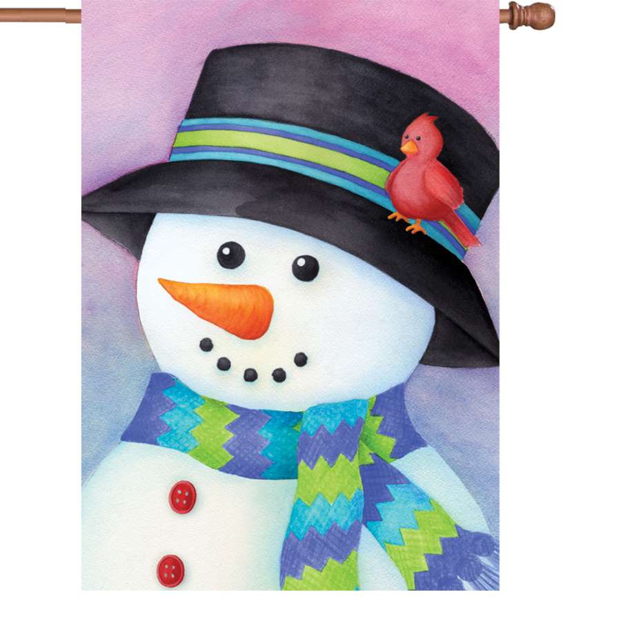 28 in. Friendly Snowman Flag featuring a smiling snowman with a scarf, displayed outdoors in a winter setting against a clear sky.