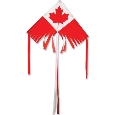 28 in. Fringe Delta Kite with Canada Flag design soaring against a blue sky, showcasing its vibrant colors and streamer tails.