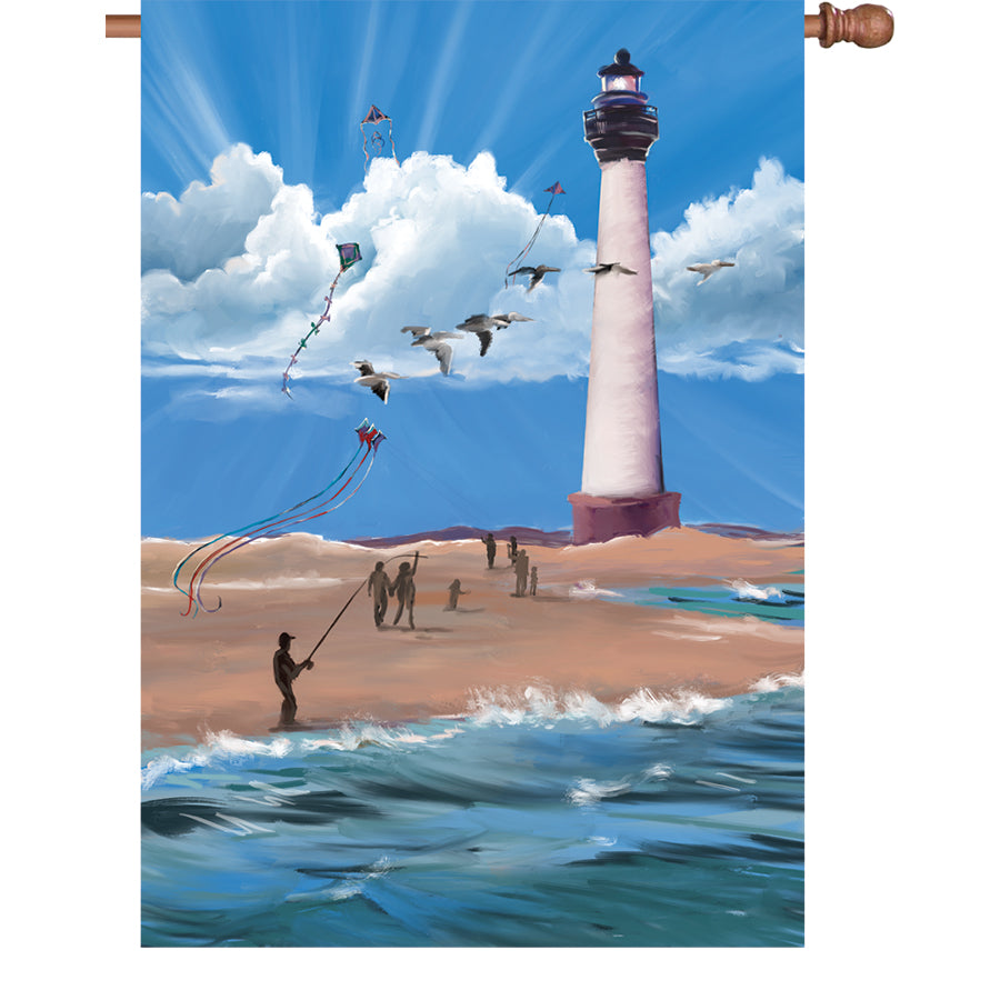 28 in. Lighthouse Breezy Day flag featuring a colorful illuminated lighthouse design, elegantly displayed outdoors, perfect for summer decoration.