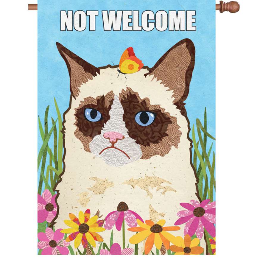 28 in. Not Welcome garden flag featuring a whimsical design for cat lovers, displayed outdoors in a vibrant garden setting.