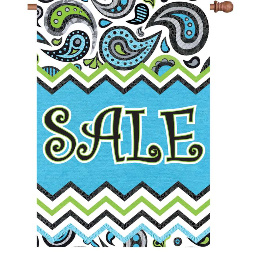 28 inch double-sided Paisley Sale flag featuring vibrant colors and printed text displayed on a flag pole in a garden setting.