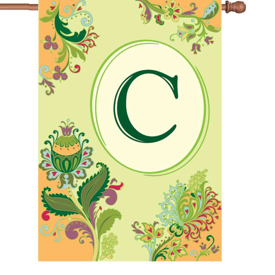 28 in. Spring Monogram Flag - C displayed on a garden pole, featuring an elegant initial and vibrant spring colors in an outdoor setting.