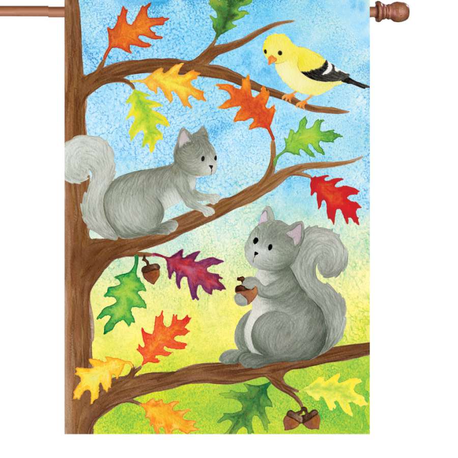 28 in Squirrel Friends illuminated flag featuring cheerful squirrels among colorful leaves, displayed on a flagpole in an outdoor setting.