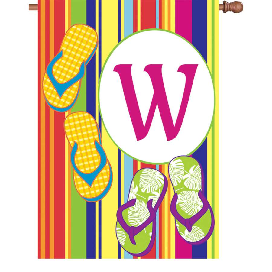 28 in. Summer Monogram Flag featuring the letter W displayed on a flagpole, showcasing colorful summer designs in a front yard setting.