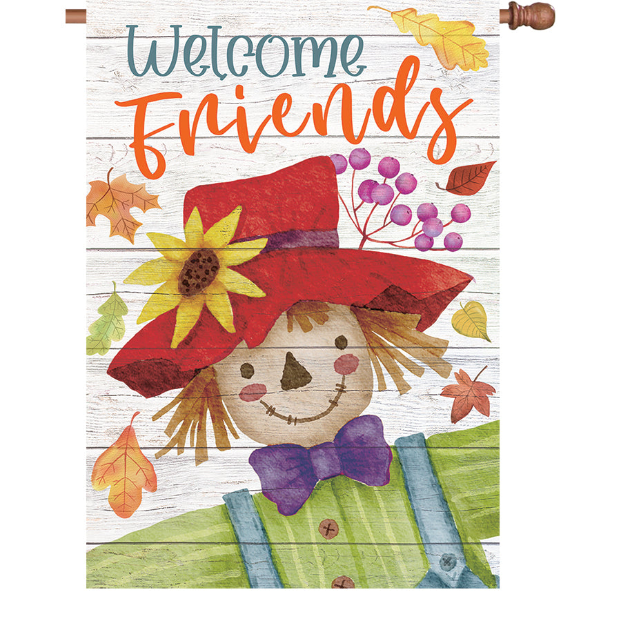 28 in. Welcome Friends flag made from velvety PremierSoft fabric, displayed outdoors welcoming visitors in a garden setting.