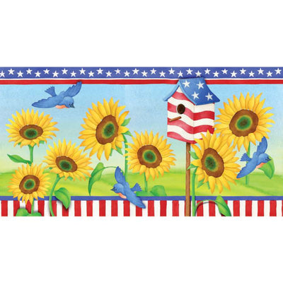 28 in. Windsock featuring bright and colorful patriotic sunflowers, beautifully fluttering in the breeze, displayed outdoors in a garden setting.