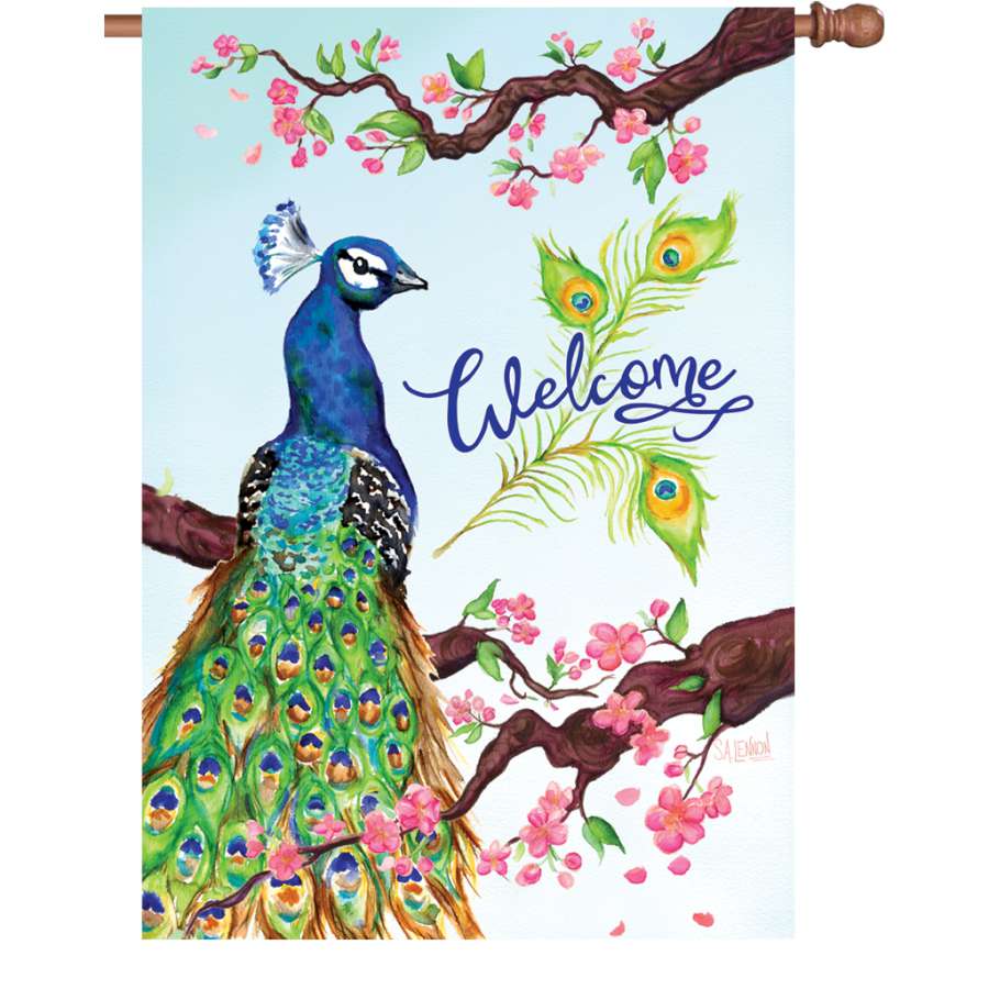 28 in. Welcome Peacock flag with vibrant peacock design displayed in an outdoor setting, fluttering gently in the breeze.