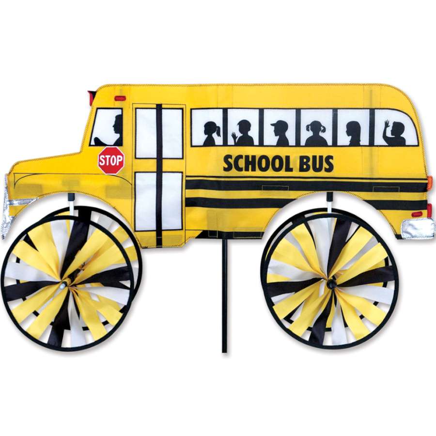 Brightly colored 29 in. School Bus Spinner twirling in the breeze, showcasing its playful design in an outdoor garden setting.