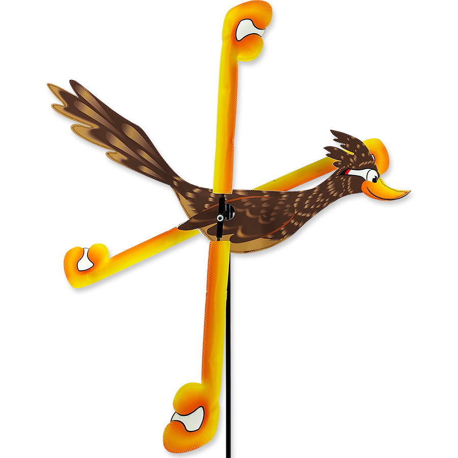29 in. WhirliGig Spinner - Road Runner design with vibrant SunTex fabric spinning in a light breeze in a garden setting.