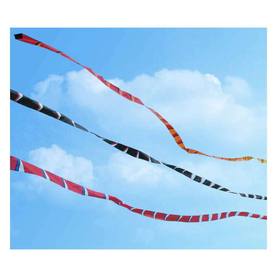 3 in. x 50 ft. Transition Tail in Black and White flowing in the wind, enhancing a kite's display against a clear sky backdrop.