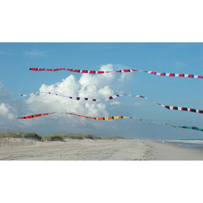 3 in. x 50 ft. Transition Tail in Black and White flowing in the wind, enhancing a kite's display against a clear sky backdrop.