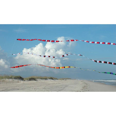 3 in. x 25 ft. Transition Tail in black and white flowing behind a kite in the sky, designed to enhance flight stability and visual appeal.