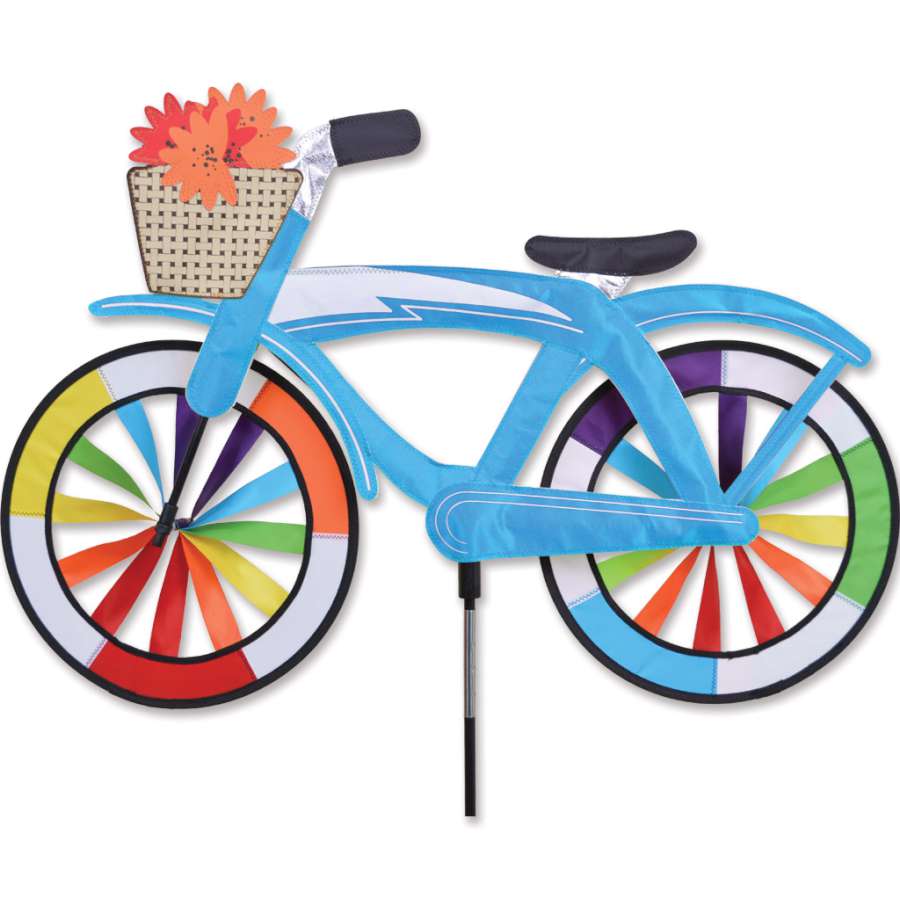 30 in. Bike Spinner in Blue Classic Cruiser design, featuring vibrant six-panel fabric rims spinning gracefully outdoors in a garden setting.
