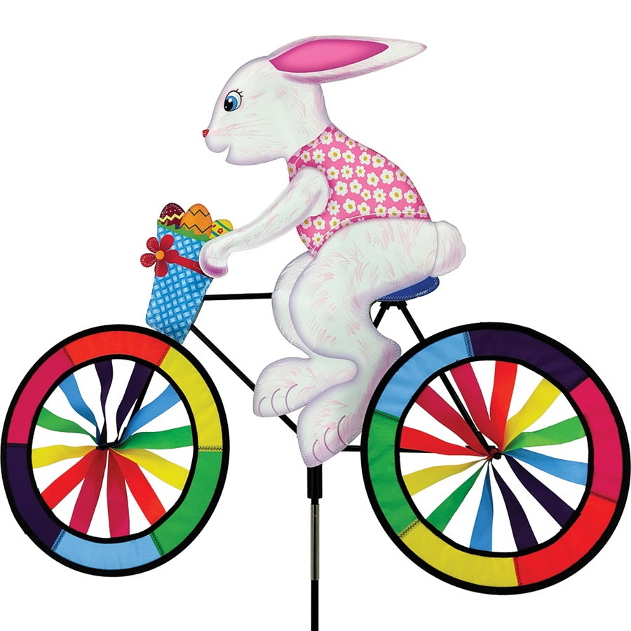 30 in. Bike Spinner featuring a colorful Easter Bunny design spinning in a garden setting on a sunny day.