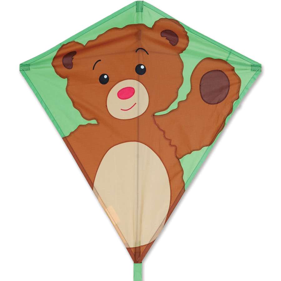 A colorful 30 in. Diamond Kite featuring a playful Teddy Bear design, soaring against a bright blue sky on a sunny day.