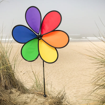 Large 30-inch 6-Petal Rainbow Flower spinner in vibrant colors displayed in a garden setting, spinning gently in the breeze.