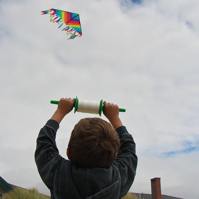 30 LB x 500' twisted kite line on spool, featuring durable twisted polyester, snap swivel, and vibrant colored spools for stylish outdoor flying.