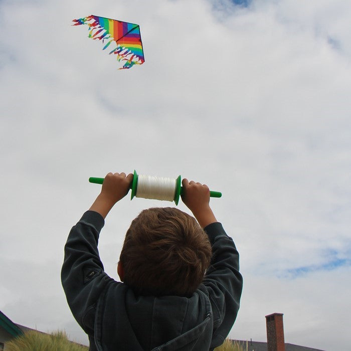 30 LB x 500' twisted kite line on spool, featuring durable twisted polyester, snap swivel, and vibrant colored spools for stylish outdoor flying.