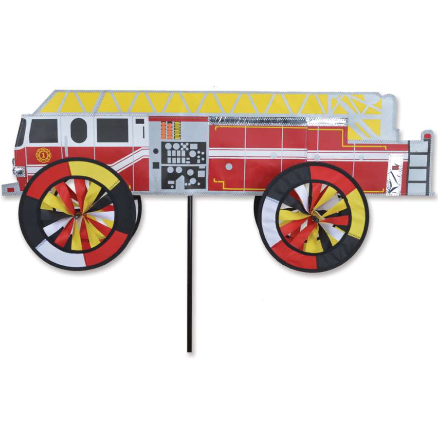 32 in. Modern Fire Truck Spinner in bright colors, spinning in the wind as a captivating decorative piece in a garden setting.