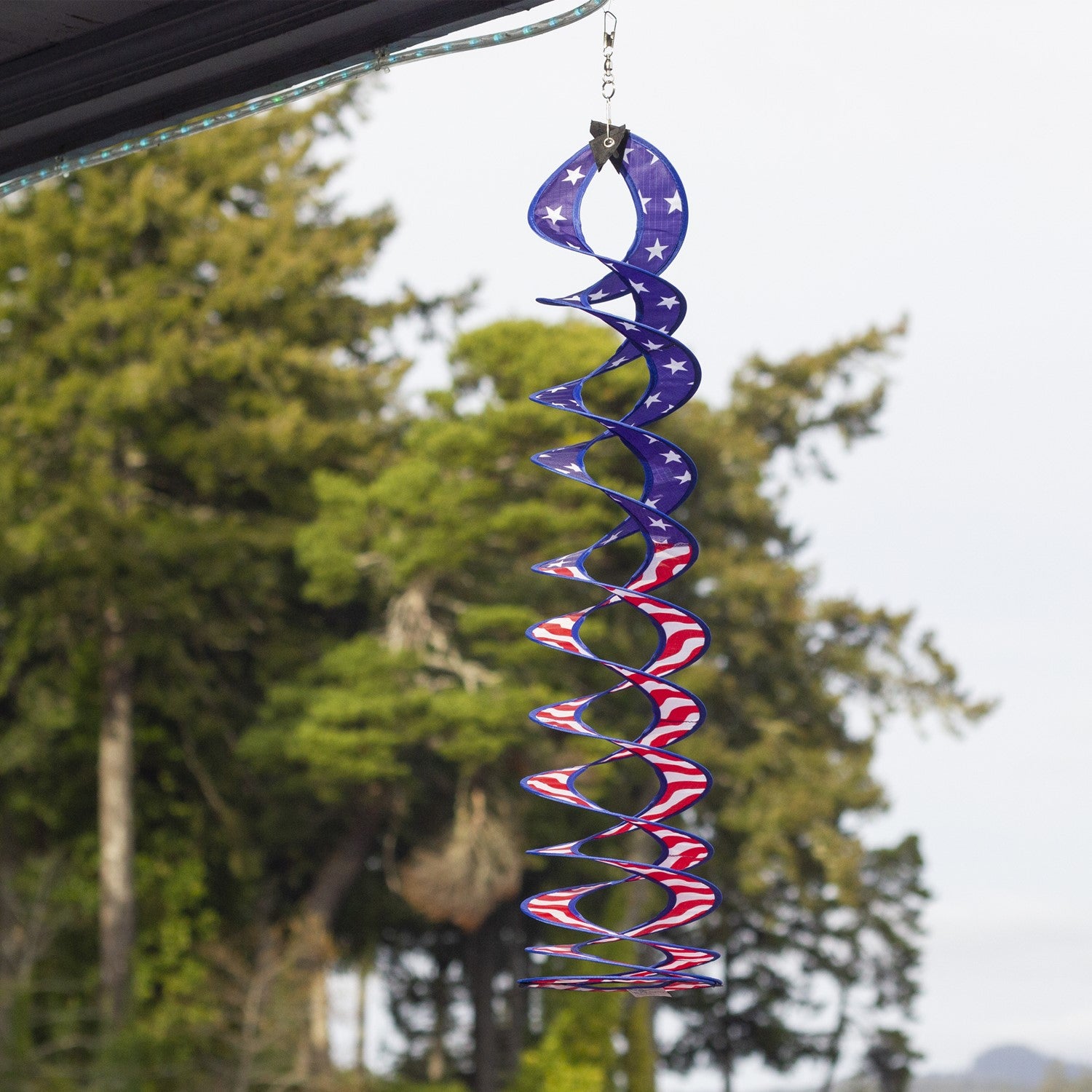 32-inch Stars & Stripes Curlie Duet featuring a double helix design, spinning in the breeze, showcasing red, white, and blue colors.