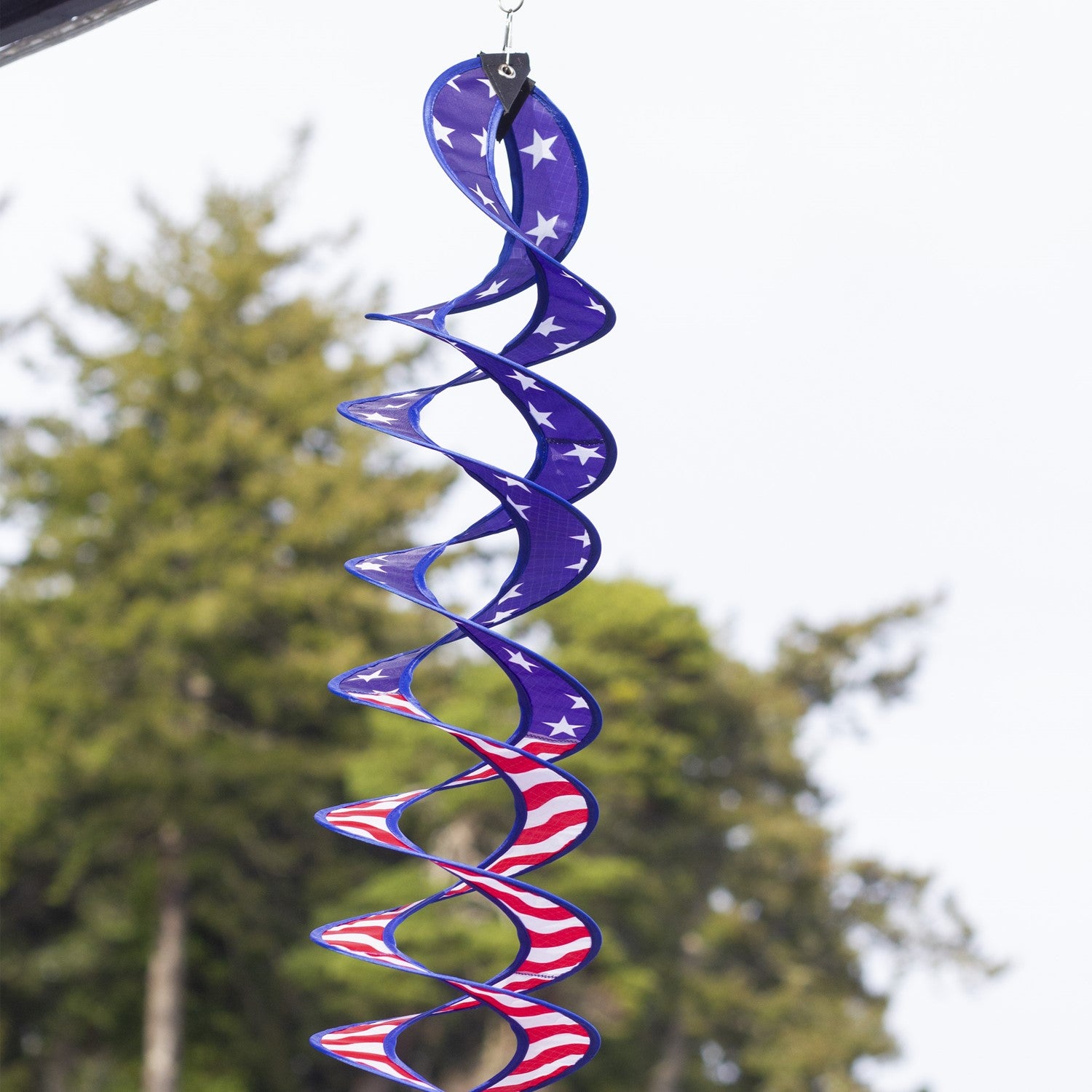 32-inch Stars & Stripes Curlie Duet featuring a double helix design, spinning in the breeze, showcasing red, white, and blue colors.