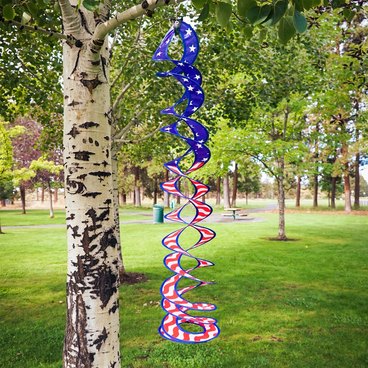 32-inch Stars & Stripes Curlie Duet featuring a double helix design, spinning in the breeze, showcasing red, white, and blue colors.