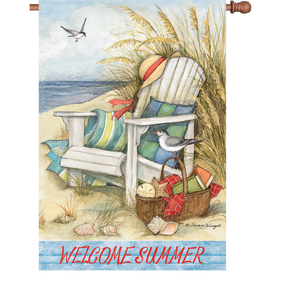 A beautifully designed 36 in. Elite Oversized House Flag featuring a beach chair, displayed on a standard house flag pole in a garden setting.