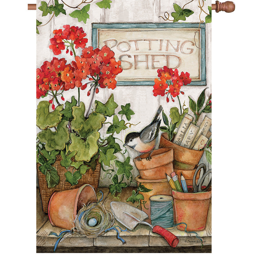 36 in. Elite Oversized House Flag showcasing vibrant Geranium Potting Shed design, displayed on a flag pole in an outdoor garden setting.