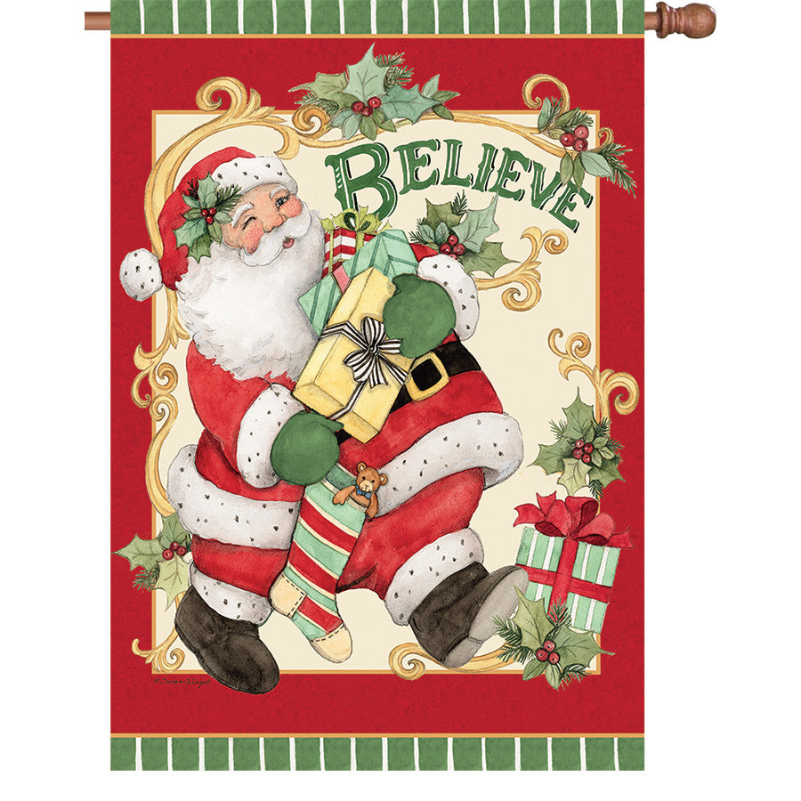 36 in. Elite Oversized House Flag featuring a retro Santa Claus design fluttering on a flag pole in a winter setting.