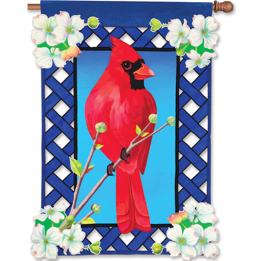 36 in. Elite Oversized Lattice Flag featuring cardinal and dogwood design, displayed on a flag pole in a lively garden setting.