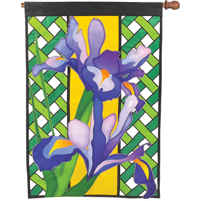 36 in. Elite Oversized Lattice Flag displaying a vibrant iris design, elegantly fluttering on a flag pole in a garden setting.