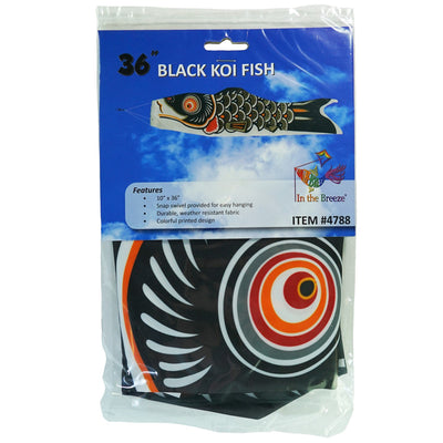 36-inch Black Koi windsock with vibrant detailing, fluttering gracefully in an outdoor garden, made from weather-resistant fabric.