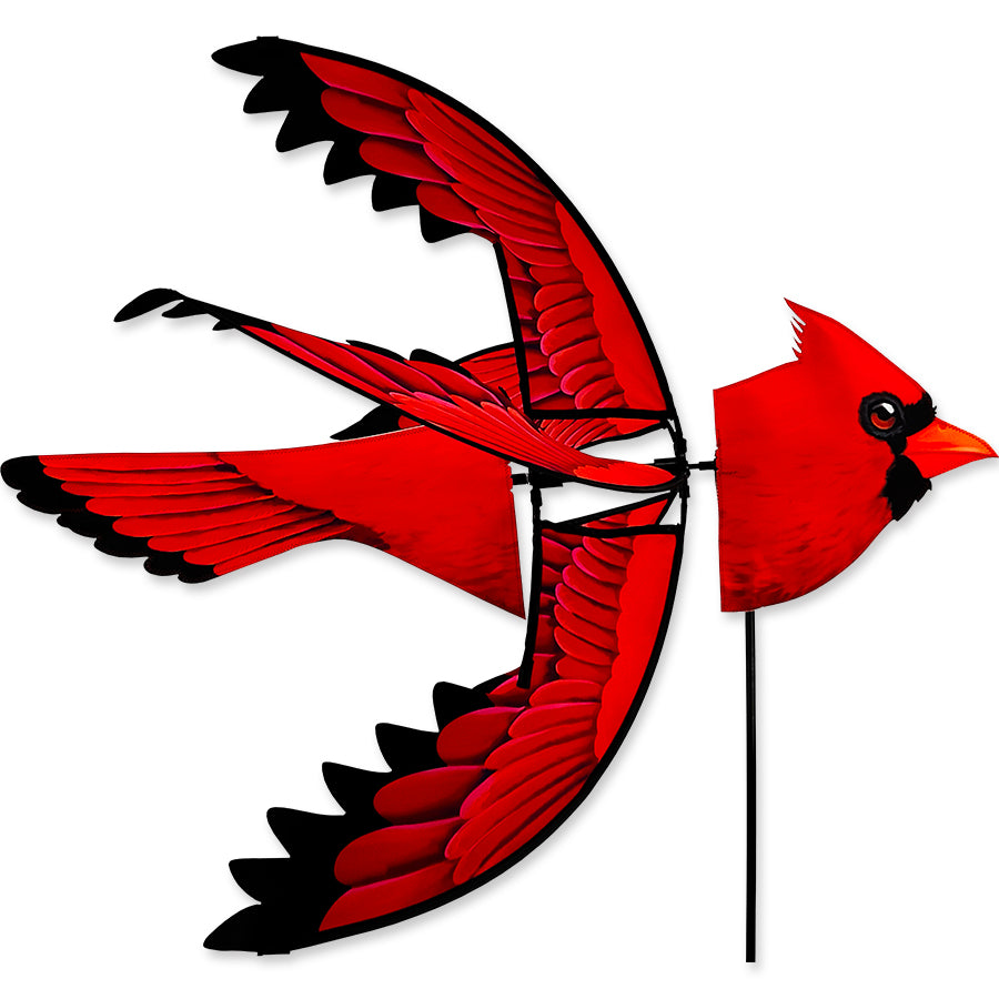 37 in. North American Cardinal Spinner displaying vibrant red and black cardinal design, elegantly spinning in an outdoor garden setting.