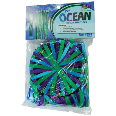 39-inch Ocean Ribbon Windsock featuring vibrant blue, green, and purple satin ribbons elegantly flowing around a PVC hoop in motion outdoors.