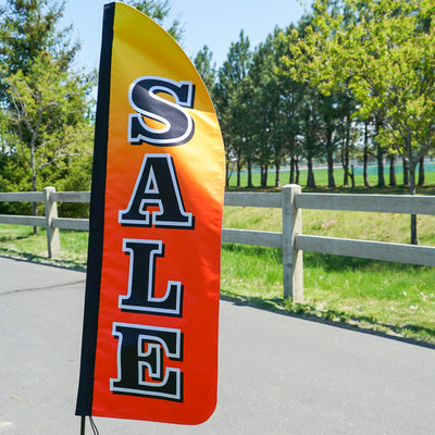 4-foot Heavy Duty Sale Gradient Double-Sided Feather Banner with vibrant rainbow gradient, displayed outdoors at a storefront to attract customers.