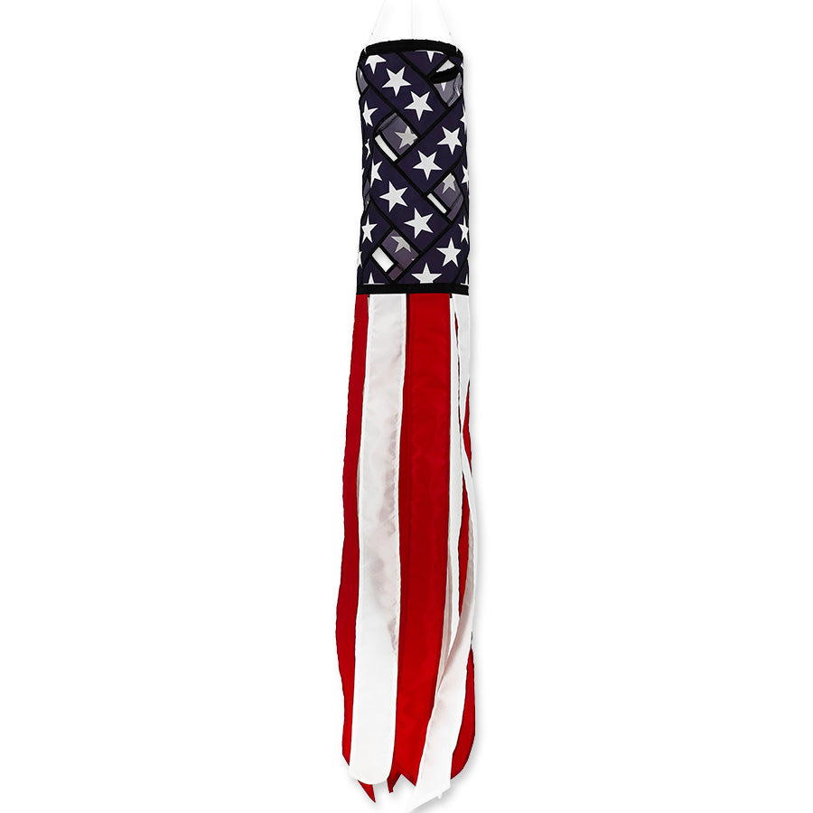 43 in. Lattice Windsock swaying gracefully in the wind, featuring a vibrant lattice design in patriotic colors, displayed outdoors in a garden setting.
