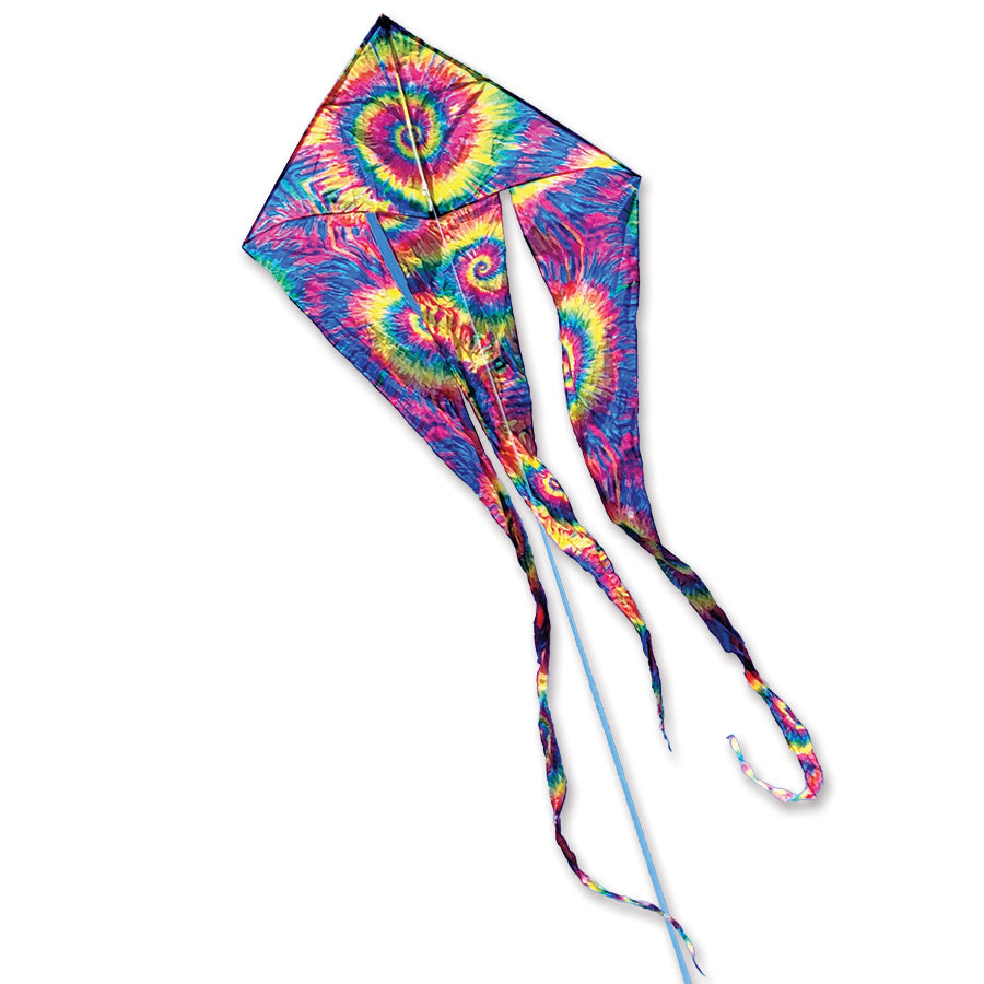 46 in. Flo-Train Delta Kite in Neon Tie Dye flying against a clear blue sky, showcasing its long tail and vibrant colors.
