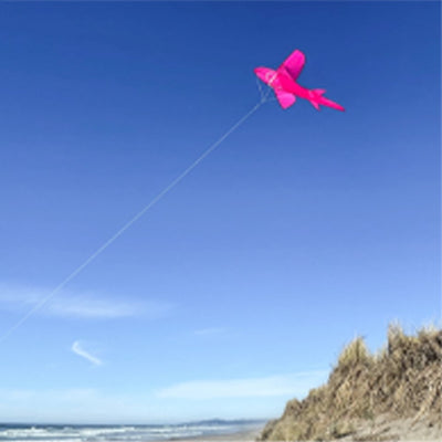 5' 3D Pink Shark Kite soaring against a clear blue sky, showcasing its vibrant colors and detailed design in flight.
