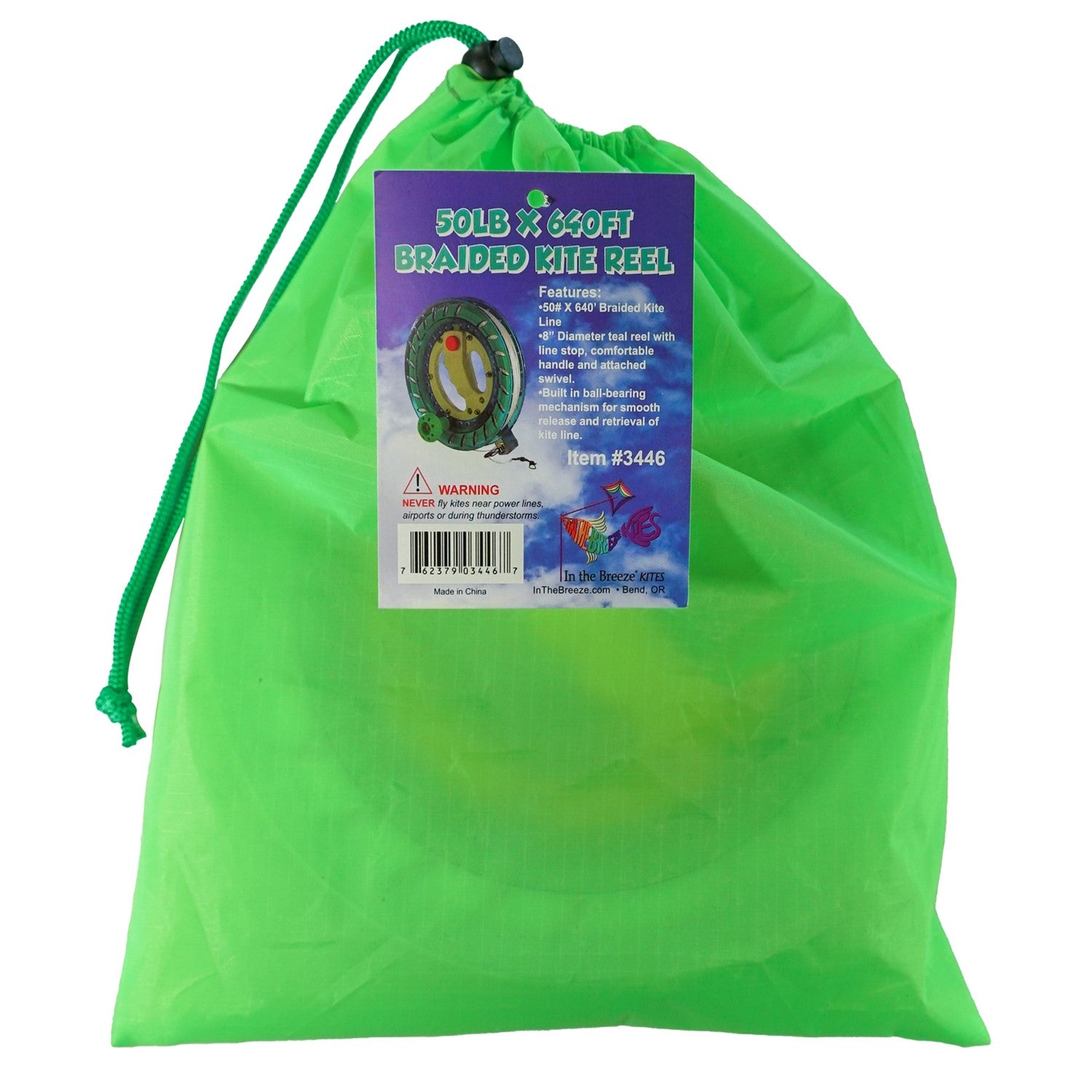 50 LB x 640' green kite reel featuring a sturdy plastic design and easy-lock mechanism, alongside a kite line smoothly wound for flying.
