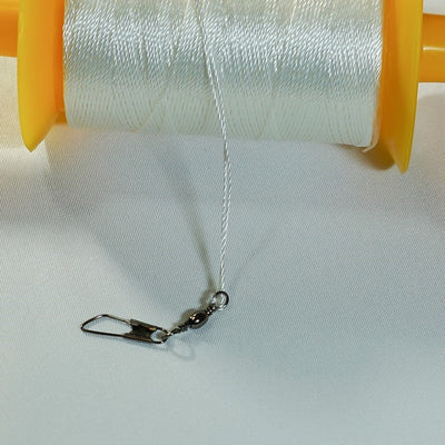 50 LB x 500' twisted kite line on spool featuring durable twisted polyester construction displayed on a colorful plastic spool.