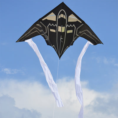 56 in. Delta Kite - Stealth Bomber soaring in the sky, measuring 56 x 28 inches, showcasing durable ripstop polyester construction.